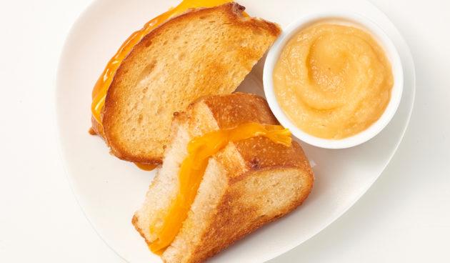 Kids grilled cheese sandwich on sourdough with applesauce