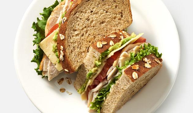 Turkey Avocado Sandwich with Havarti, tomatoes, lettuce and mayo on multigrain bread