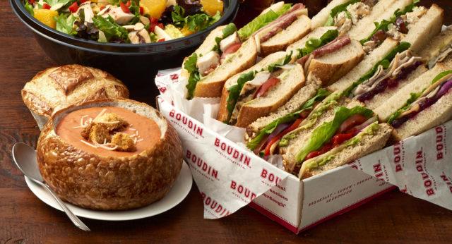 Catering sandwich assortment, tomato soup in a bread bowl, Asian chicken salad and desserts