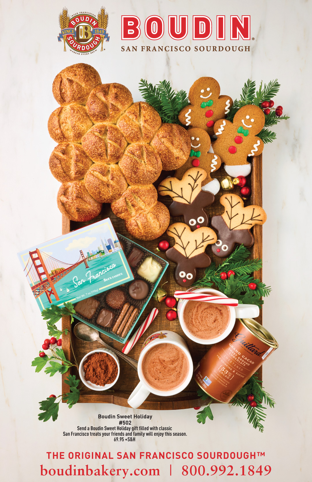 Boudin Sweet Holiday #502 with Sourdough Holiday Tree, Gingerbread and Reindeer Cookies, Chocolates and Hot Cocoa in a wooden tray on marble surface and priced at 69.95 +S&H