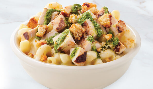 Chicken Pesto Mac & Cheese in bowl on marble surface