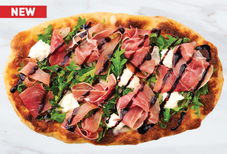 Prosciutto Bianca Pinsa Pizza on Marble Surface