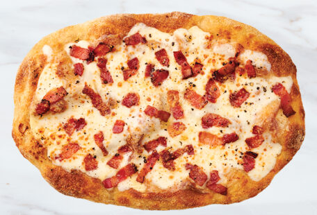 Bacon Carbonara Pinsa Pizza on Marble Surface