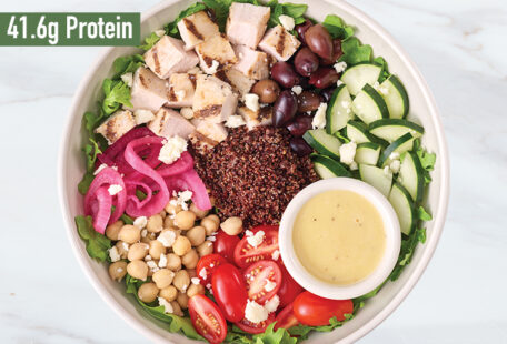 Mediterranean Chicken with Lemon Hummus protein bowl on marble surface