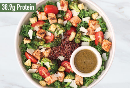 Pesto Parmesan Chicken protein bowl on marble surface