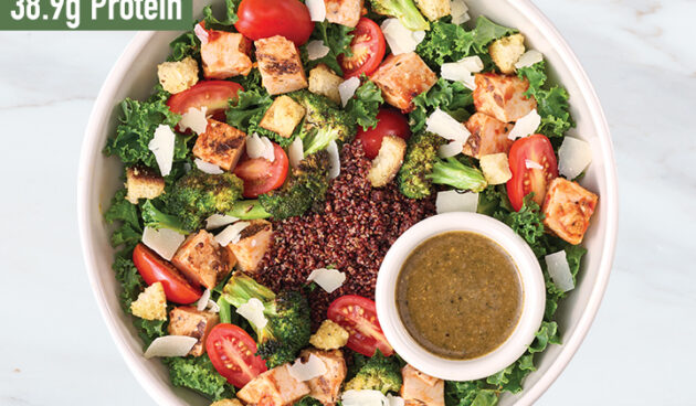 Pesto Parmesan Chicken protein bowl on marble surface