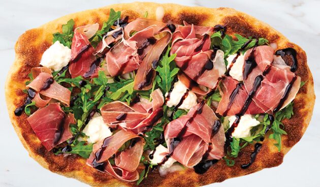 Prosciutto Bianca Pinsa Pizza on Marble Surface