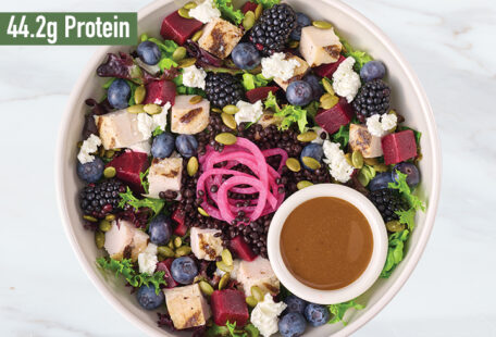 Roasted Beet & Berry with Goat Cheese protein bowl on marble surface