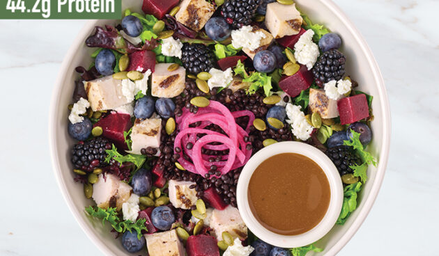 Roasted Beet & Berry with Goat Cheese protein bowl on marble surface