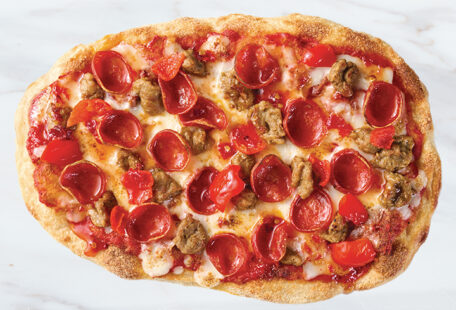 Sausage, Pepperoni & Hot Honey Pinsa Pizza on Marble Surface